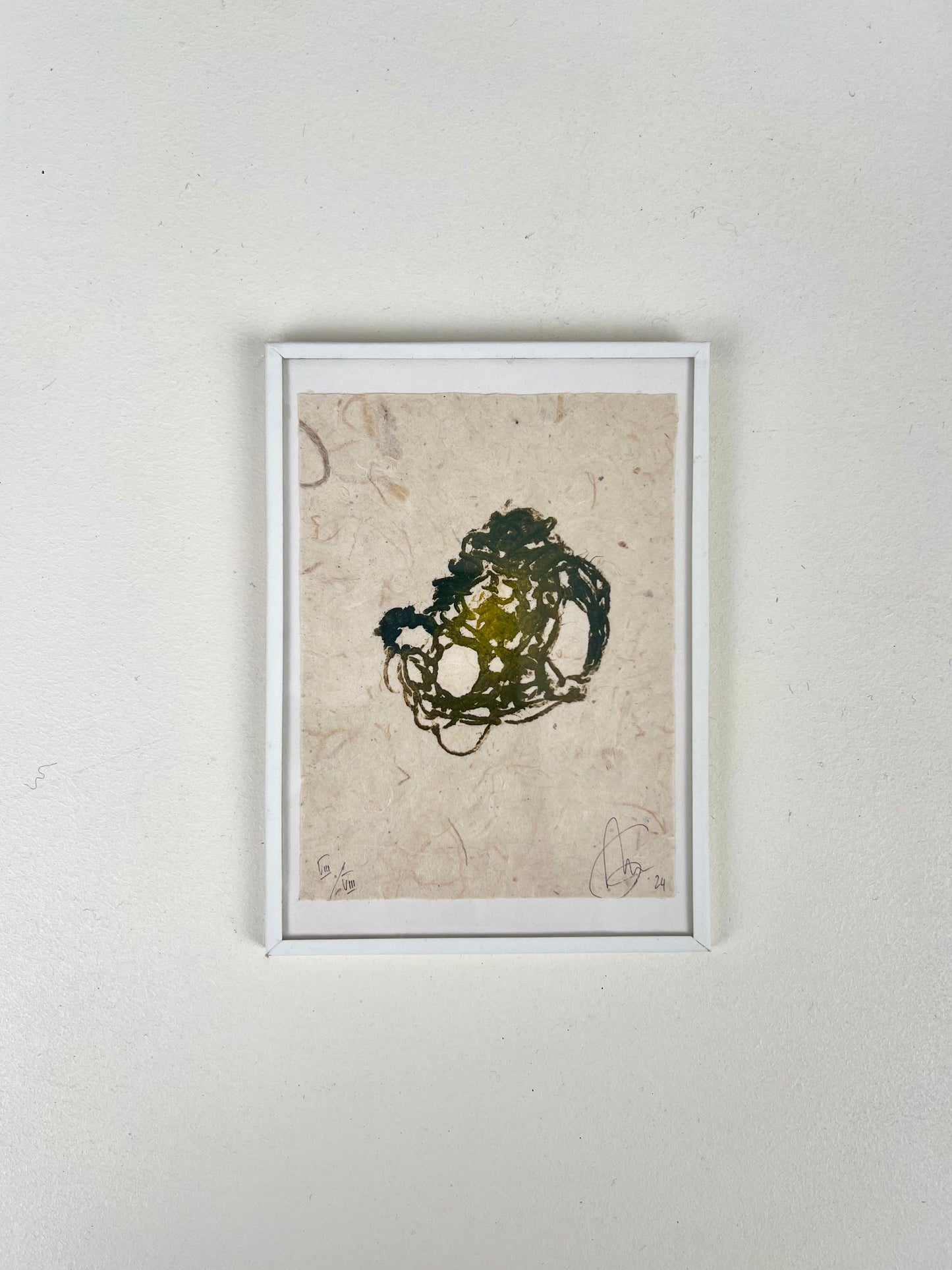 Estampe de crochet verte encadrée sur papier texturé artisanal