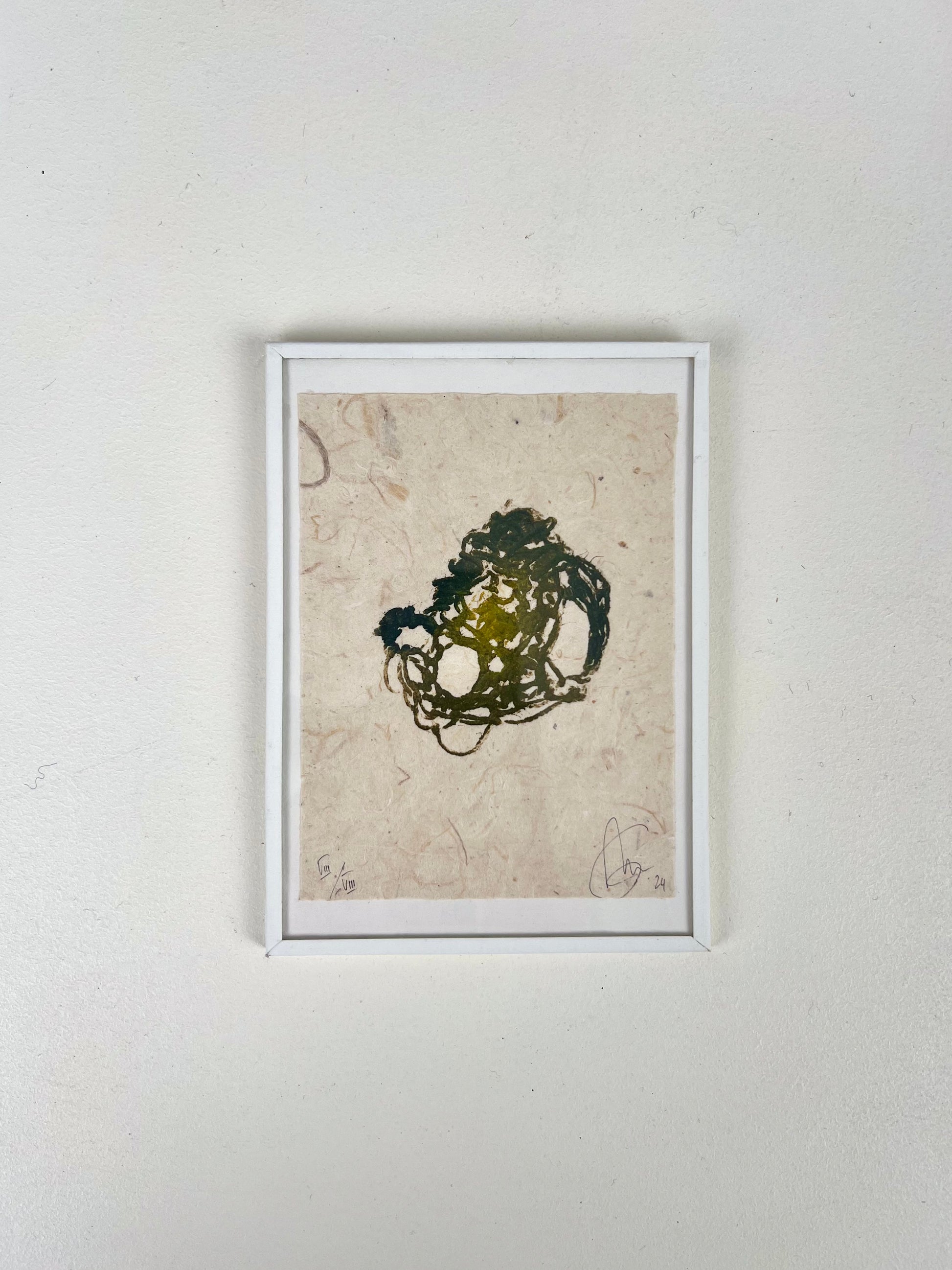 Estampe de crochet verte encadrée sur papier texturé artisanal